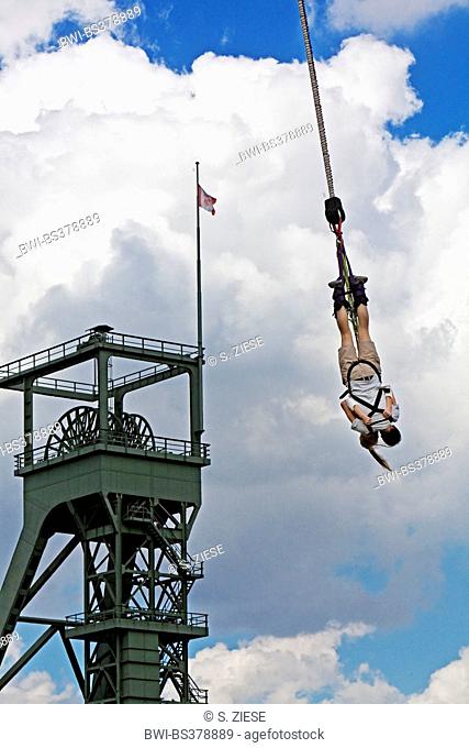 bungee jumping in front of a pit frame in Olga Park, Germany, North Rhine-Westphalia, Ruhr Area, Oberhausen