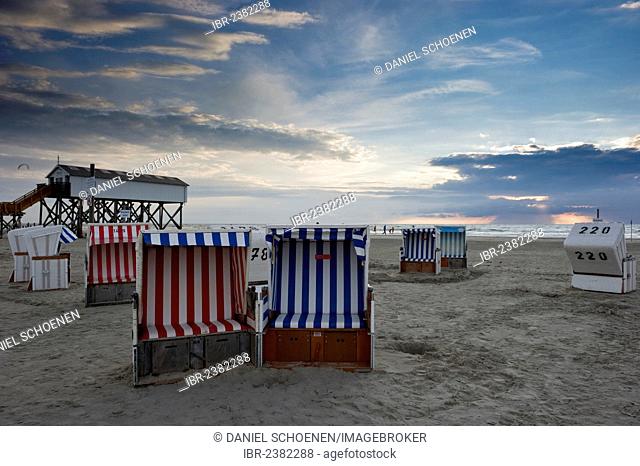 Beach chairs and house on stilts on the beach of St. Peter-Ording, North Frisia, Schleswig-Holstein, Germany, Europe