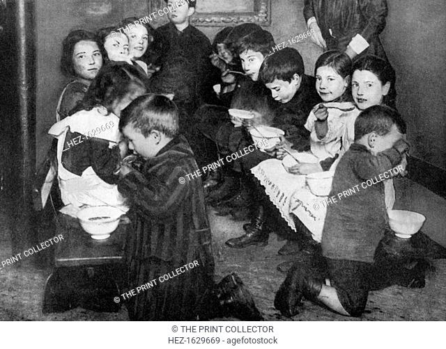 Children in a communal kitchen, London, 1917, (1936). From His Majesty the King, 1910-1935, introduction by HW Wilson (Associated Newspapers Ltd, London, 1936)