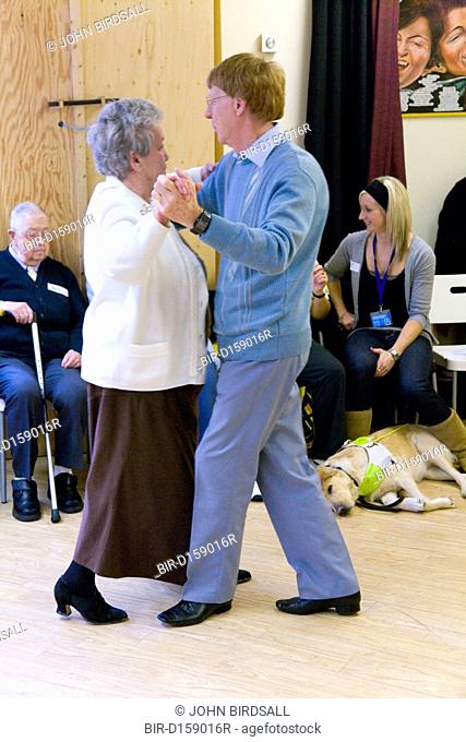 Dance teacher dancing with one of his visually impaired students at NRSB activity day at their centre on Ortzen Street, This is part of the IMPACT project