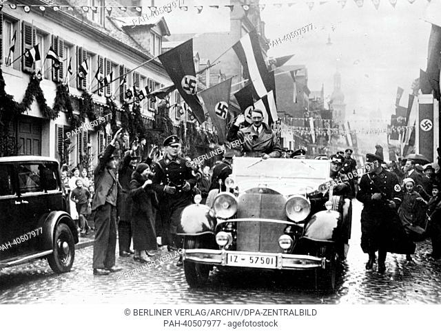 The people welcome Adolf Hitler enthusiastically upon his arrival in Saarbrücken, Germany, on the occasion of the handover of the Saarland to Germany