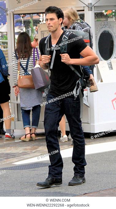 The Bold and the Beautiful soap actor, Adam Gregory carries his son, Kannon in a back carrier while shopping at The Grove in Hollywood Featuring: Adam Gregory