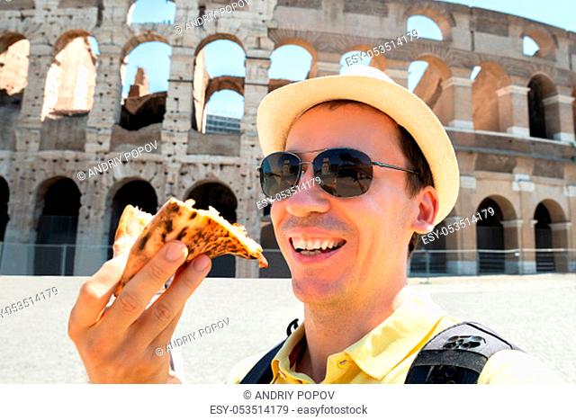 Man Eating Italian Pizza Near Colosseum, Rome