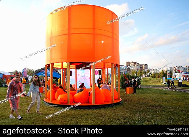 RUSSIA, ST PETERSBURG - JULY 1, 2023: People sit on bean bags in a makeshift pavilion at the 2023 VK Fest in St Petersburg 300th Anniversary Park