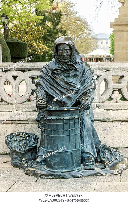 Spain, Burgos, Statue of a roasted chestnut vendor