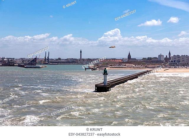 French harbor of Calais with breakwater and heavy storm