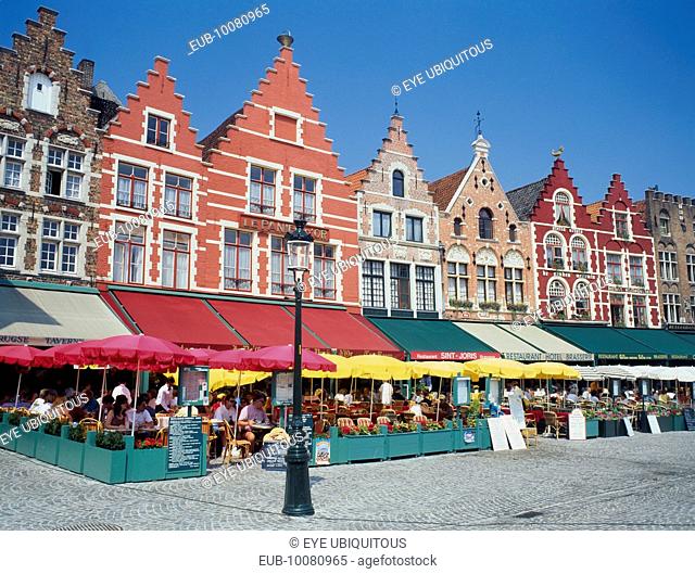 The west side of the Main Square, Grote Markt, with outdoor restaurants and umbrellas