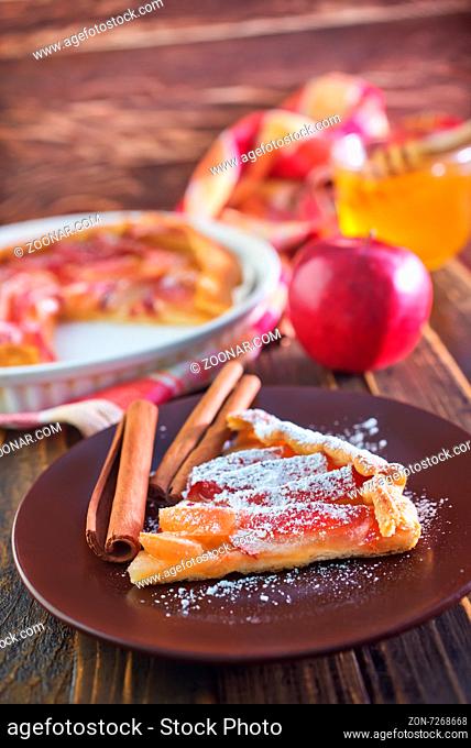 apple pie on plate and on a table