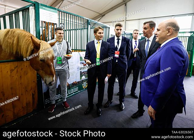 RUSSIA, MOSCOW - OCTOBER 5, 2023: Russia's Prime Minister Mikhail Mishustin and Agriculture Minister Dmitry Patrushev (R-L) visit a horse stable ahead of a...