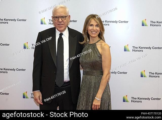 David Rubenstein and Caryn Zucker arrive for the Medallion Ceremony honoring the recipients of the 46th Annual Kennedy Center Honors at the Department of State...