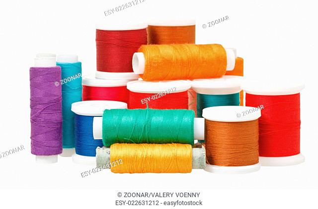 multicolored thread spools isolated on white