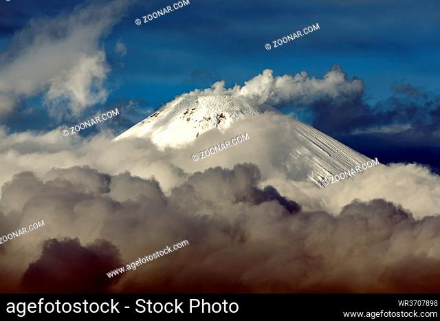 Volcanic landscape of Kamchatka Peninsula: top of cone of active Avacha Volcano, fumaroles activity of volcano - steam and gas plume from crater