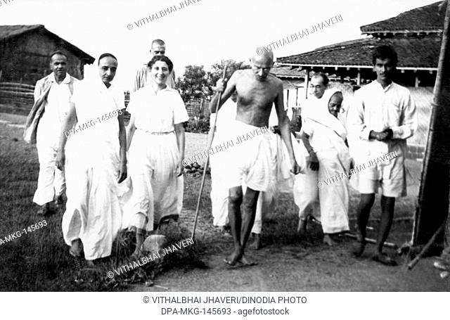 Balwant Singh presents a newborn four hours old calf to Mahatma Gandhi and others at Sevagram Ashram , 1940 NO MR