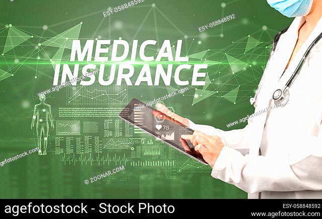 doctor writes notes on the clipboard with MEDICAL INSURANCE inscription, medical diagnosis concept