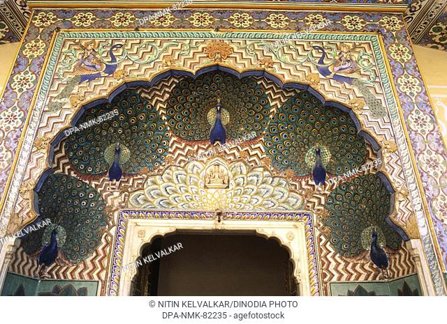 richly painted top of peacock gate , city palace , jaipur , rajasthan , india
