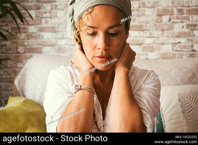 Adult people woman touching her neck with worried expression on face. Woman and life problems concept. Lonely female suffering depression and loneliness alone...