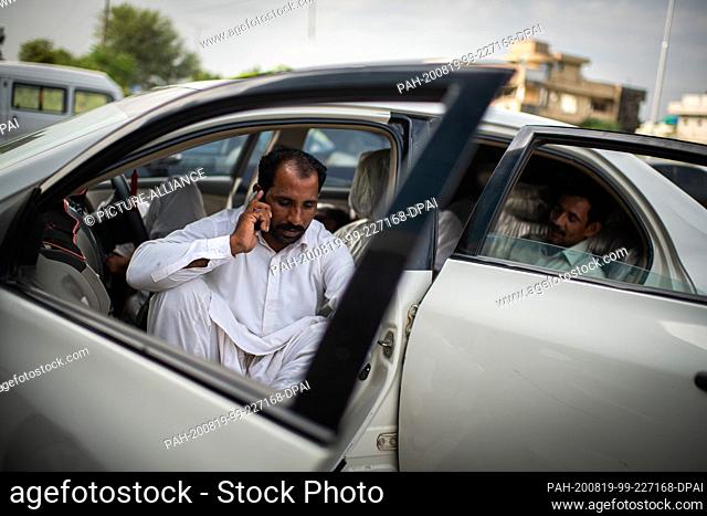 19 August 2020, Pakistan, Islamabad: Relatives wait in their car in front of a building of the Pakistani criminal investigation department FIA for their...