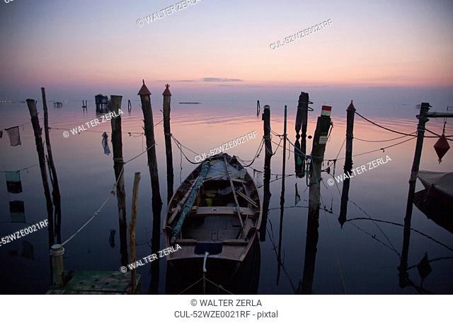 Fishing boat with nets in still water
