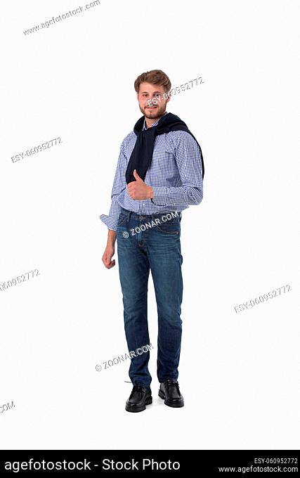 Full length portrait of young man showing thumb up isolated on white background