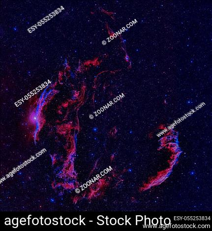 The Veil Nebula or NGC 6960 is a cloud of heated and ionized gas and dust in the constellation Cygnus. Retouched colored image