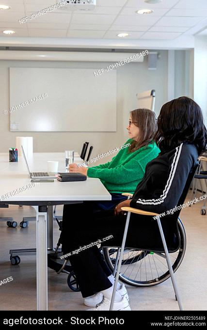 Disabled woman during meeting in office