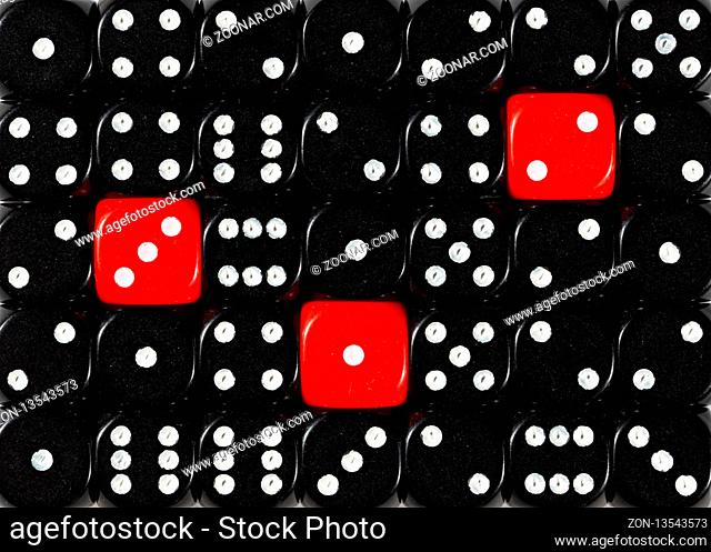 Pattern background of random ordered black dices with three red cubes
