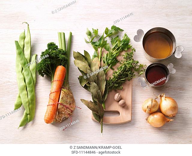 Various soup ingredients vegetables, herbs, stock