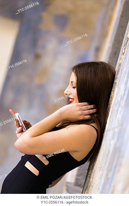 Stock Photo - Teen girl using smartphone