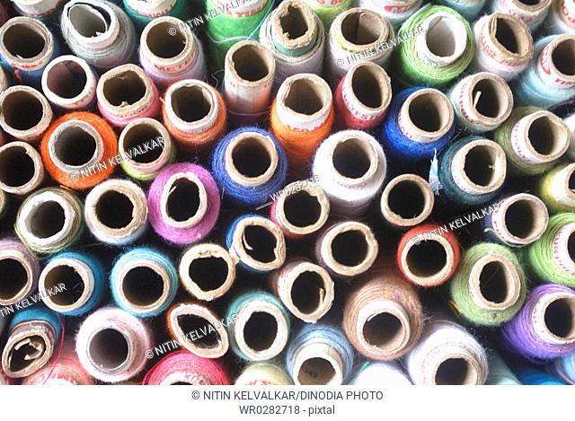 Aerial view of reels of threads of various colors tailoring material , Pen , Raigad District , Maharashtra , India