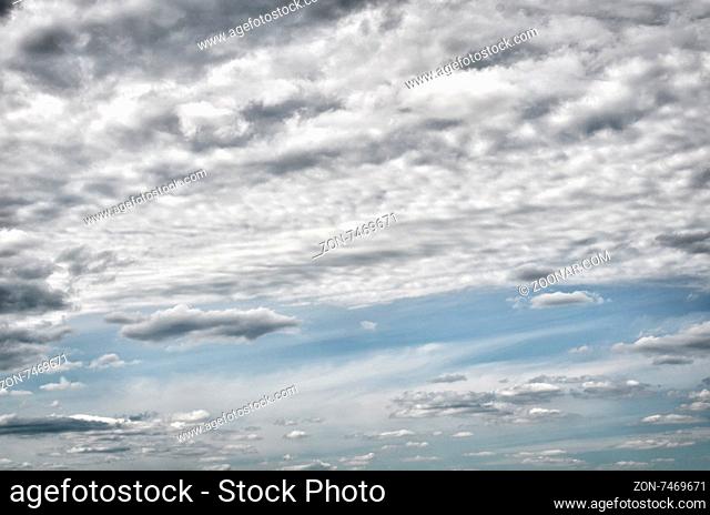 The blue sky with clouds a background