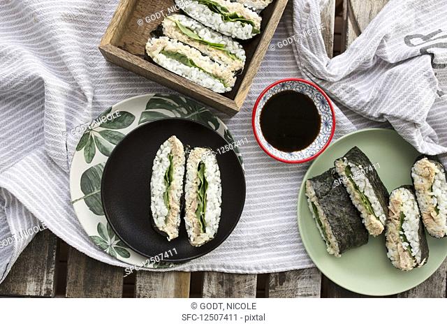 Sushi sandwiches with tuna fish cream and lettuce leaves