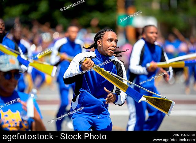 Chicago, Illinois, USA - August 8, 2019: The Bud Billiken Parade, Members of the Golden Knights Drill Team performing at the parade