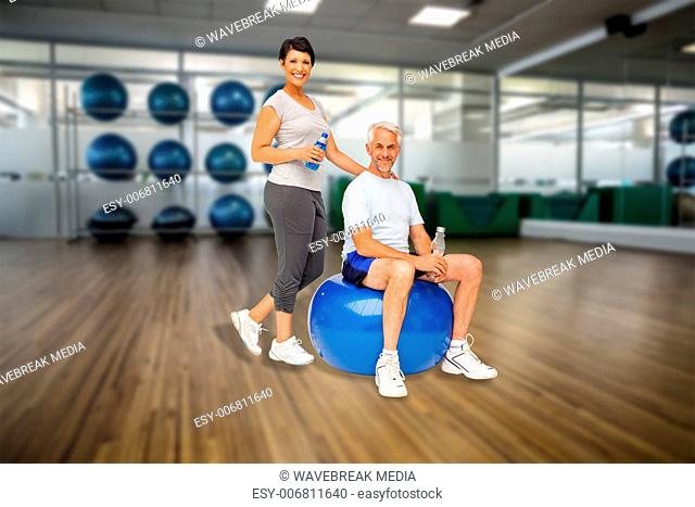 Composite image of full length portrait of a happy fit couple