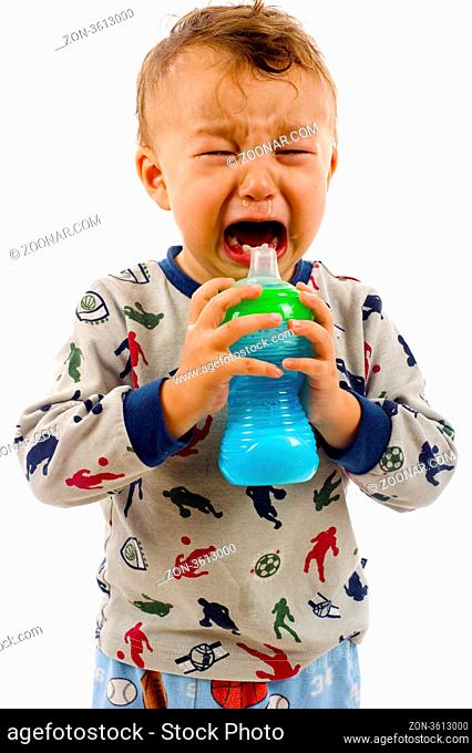 Baby Boy Crying while Drinking his Milk Bottle -Isolated over a White Background