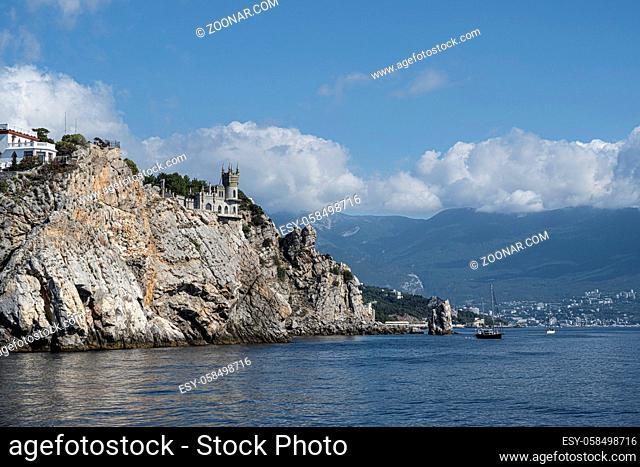Castle on the rock swallow's nest on the background of mountains and clouds in Crimea, Russia. Sunny day September 7, 2020