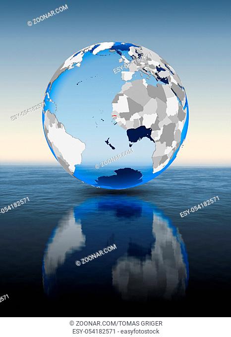 Gambia In red on globe floating in water. 3D illustration