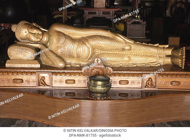 nirvana Reclining sleeping buddha sandal wood statue , horinji Japanese temple , sarnath , uttar pradesh , india