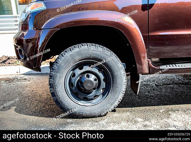 Samara, Russia - May 4, 2019: Close up view of UAZ Patriot vehicle wheel with tire