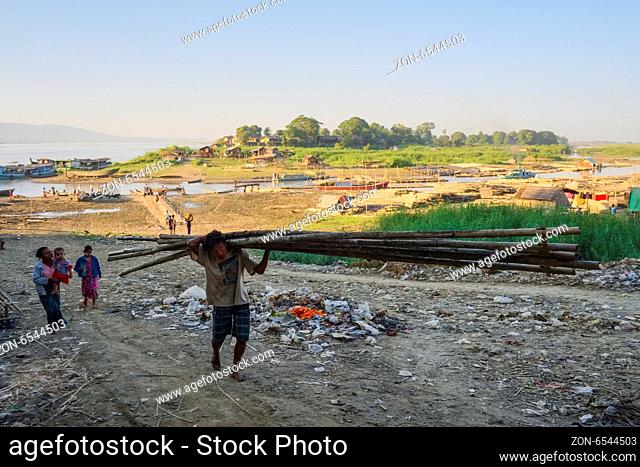 Porters on the banks of the Ayeyarwady River, Mandalay, Myanmar