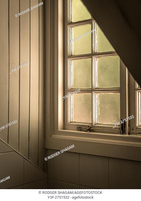 A loft window, frosted glass kjeeps out the glare