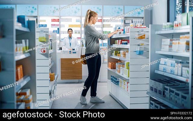 Customer choosing medication in a pharmacy