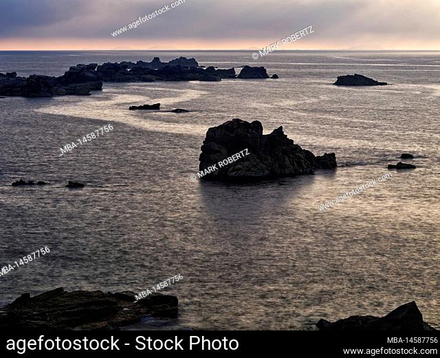 Evening twilight on the rocky coast Le Gouffre, Brittany, France