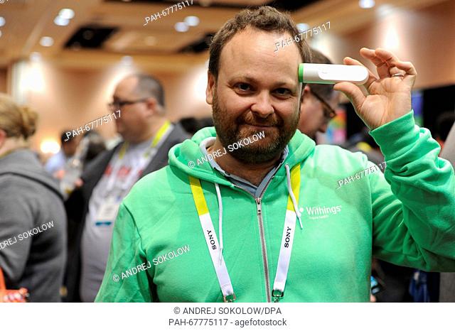 A file picture shows Cedric Hutchings, head and co-founder of the company Withings, as ge presents the new infrared thermometer of the company at the Consumer...