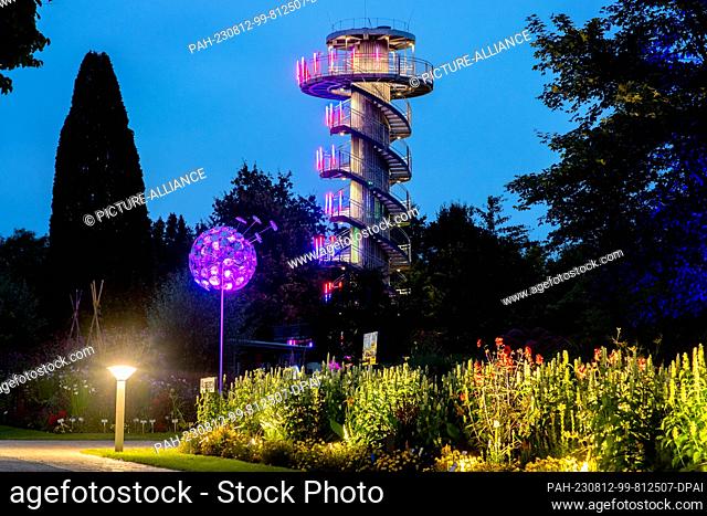 PRODUCTION - 10 August 2023, Lower Saxony, Bad Zwischenahn: Numerous flowerbeds and the observation tower will be illuminated in the Park der Gärten during...