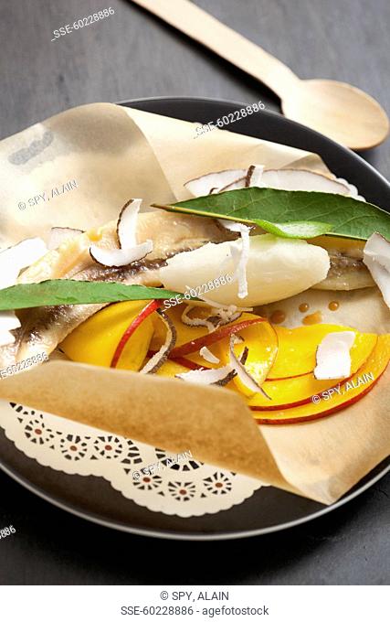 Exotic fruit cooked in wax paper with sorbet
