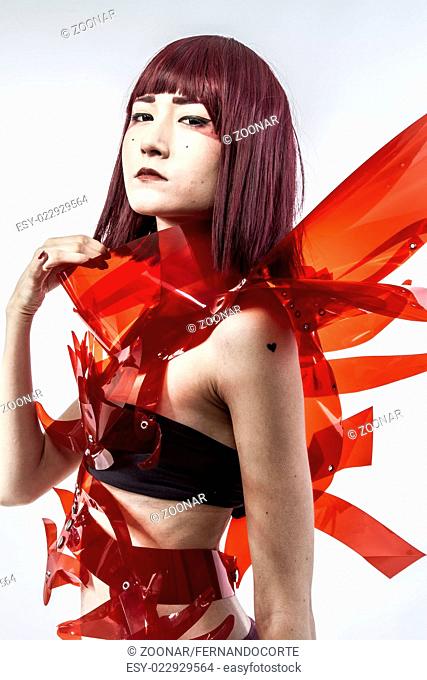 Japanese woman in costume of red plastic, modern and future concept