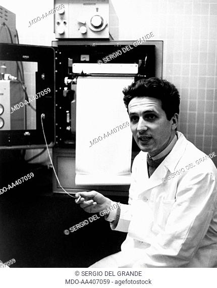 Silvio Garattini using a medical equipment. Italian doctor and research worker Silvio Garattini using the gas chromatography equipment at the Mario Negri...