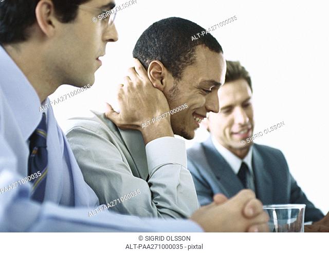 Businessmen sitting together in meeting
