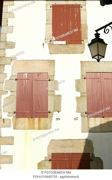 Red shutter windows of Sare, France in Basque Country on Spanish-French border, a hilltop 17th century village surrounded by farm fields