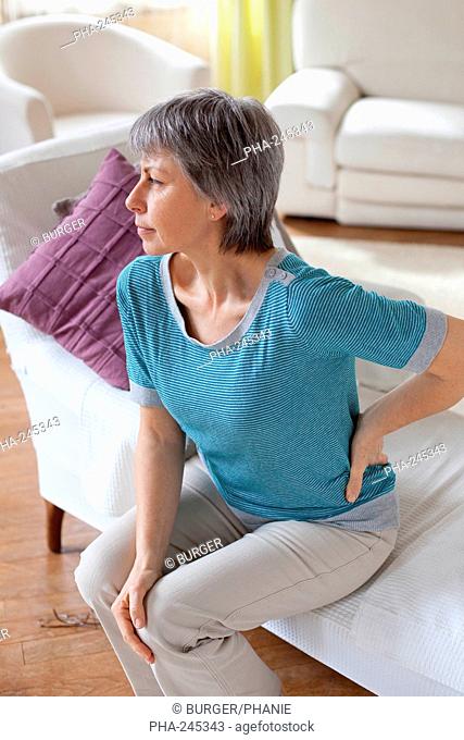 Woman suffering back pain